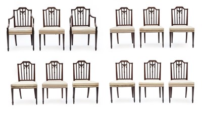 Lot 332 - A Set of Twelve Carved Mahogany Hepplewhite Style Dining Chairs, including two carvers, the...