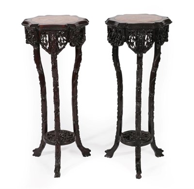 Lot 340 - A Pair of Early 20th Century Chinese Padouk Wood and Pink Marble Plant Stands, the circular...