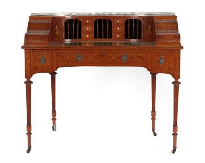 Lot 345 - An Edwardian Satinwood Carlton House Style Desk, early 20th century, with pierced brass gallery...