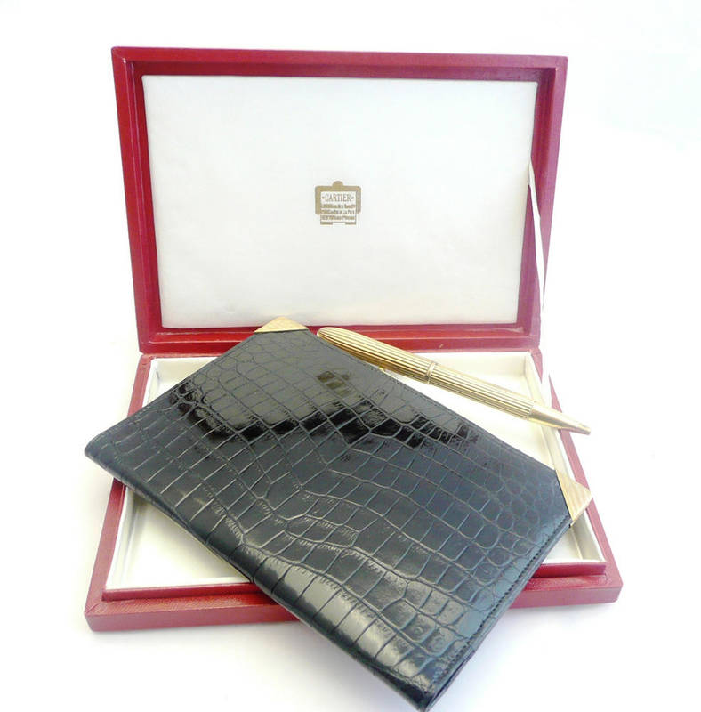 Lot 394 - A Cartier 9ct Gold Ballpoint Pen, with fluted case and pierced pocket clip, London marks,...
