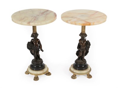 Lot 380 - A Pair of Green Onyx and Bronze Occasional Tables, the circular tops above reeded brass columns the