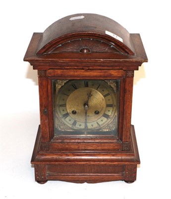 Lot 11 - An oak cased striking mantel clock with brass dial, circa 1900