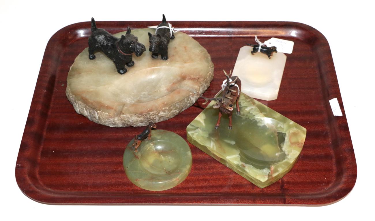 Lot 33 - Three bronze mounted onyx dishes and a spelter terrier mounted ashtray (4)