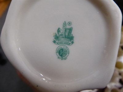 Lot 48 - A collection of Belleek ceramics including: teapots; bowls; small baskets; cups and saucers;...