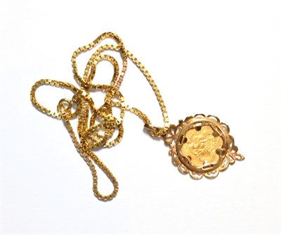 Lot 73 - An 1897 half sovereign loose mounted as a pendant on chain, pendant length 4.8cm, chain length 61cm