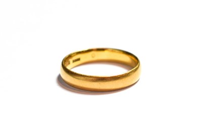 Lot 74 - A 22 carat gold band ring, finger size N1/2