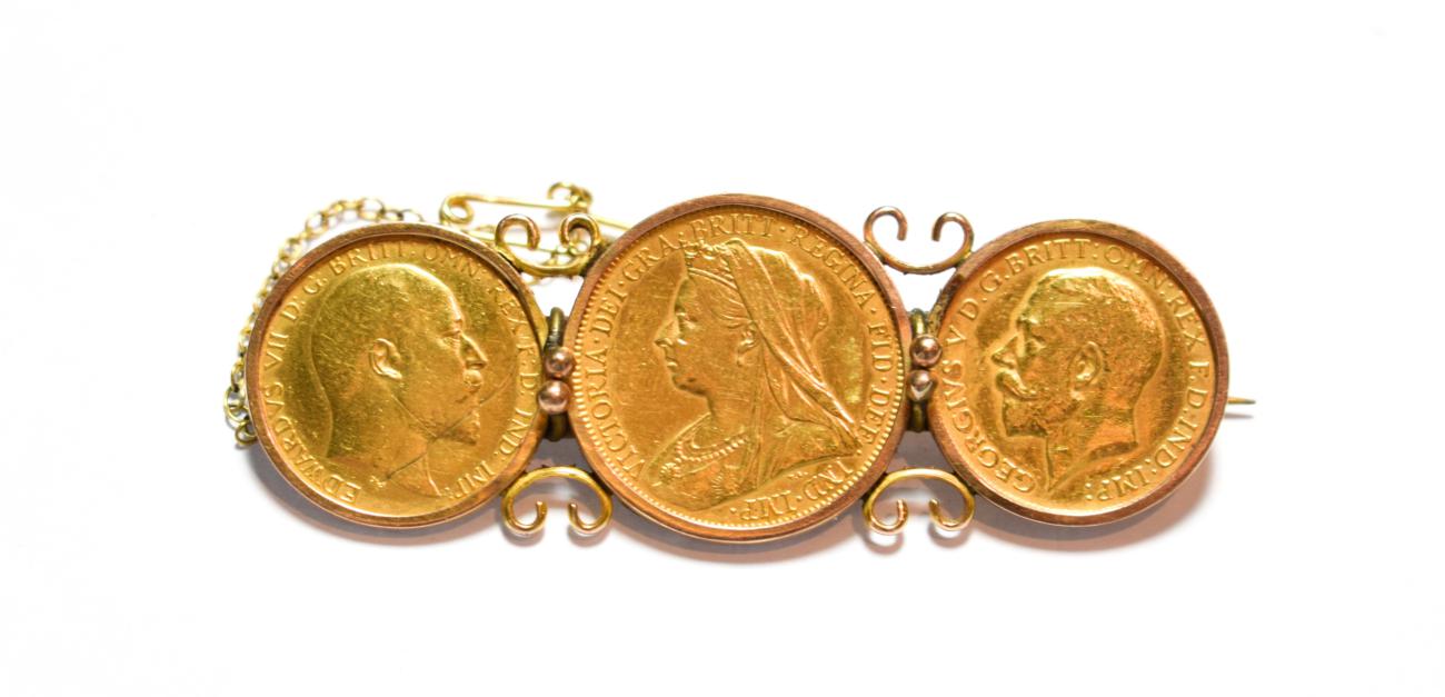Lot 84 - An 1897 full sovereign and two half sovereigns dated 1913 and 1907 mounted as a brooch, length...