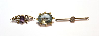 Lot 106 - An aquamarine and seed pearl brooch, length 3.5cm; an amethyst and seed pearl brooch, stamped...