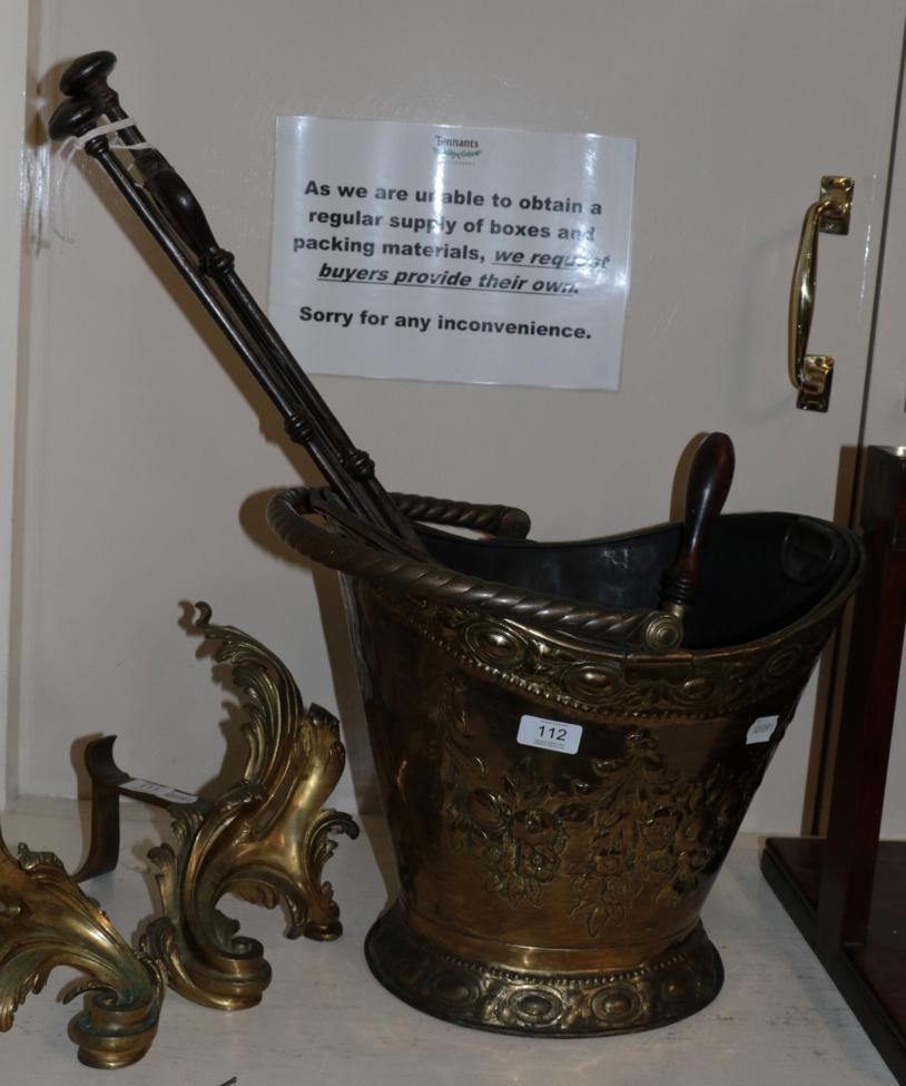 Lot 112 - A brass coal bucket; and three steel fire irons