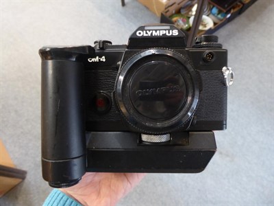 Lot 125 - A bag of cameras including Olympus OM4