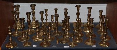 Lot 134 - A large collection of brass candlesticks