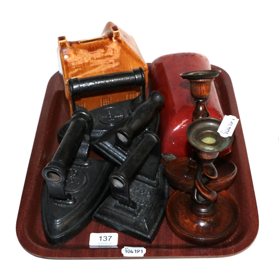 Lot 137 - Four Victorian flat irons; a Nowell's patent foot warmer; a 20th century Holkham treacle glazed...