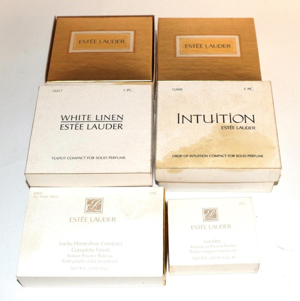 Lot 143 - Four assorted Estée Lauder solid perfume compacts, comprising 'Petit Four'; 'Drop of...