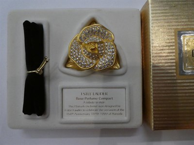Lot 143 - Four assorted Estée Lauder solid perfume compacts, comprising 'Petit Four'; 'Drop of...