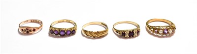 Lot 168 - A textured 9 carat gold ring, finger size P; a 9 carat gold amethyst and seed pearl ring,...