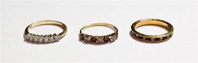 Lot 175 - A 9 carat gold diamond seven stone ring, finger size R; a 9 carat gold gemset seven stone ring,...
