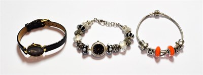 Lot 178 - A Pandora charm bracelet hung with nine charms; a Rotary wristwatch; and an Accurist charm bracelet