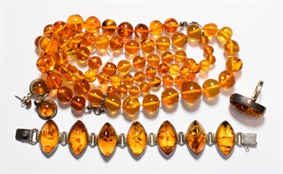 Lot 179 - An amber type suite comprising a necklace, a bracelet, a ring; and a pair of drop earrings