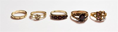 Lot 182 - A 9 carat gold eternity ring, finger size L1/2 (a.f.); a 9 carat gold ring, finger size P; a 9...