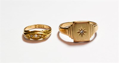 Lot 187 - A 9 carat gold diamond set signet ring; and an 18 carat gold diamond five stone ring, finger size M