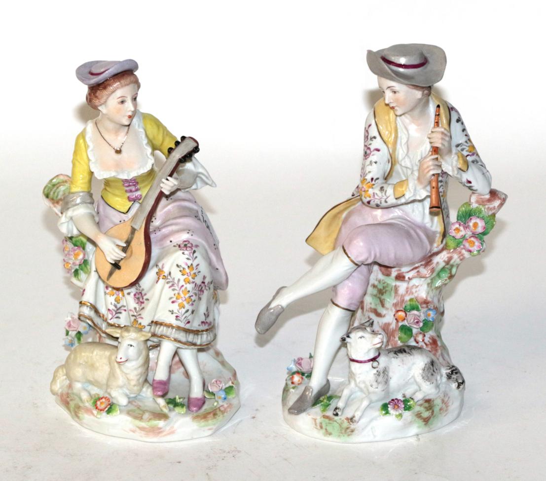 Lot 204 - A pair of 18th century style Sitzendorf pastoral figures