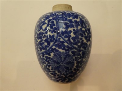 Lot 211 - A Chinese blue and white floral decorated vase with a pierced hardwood stand