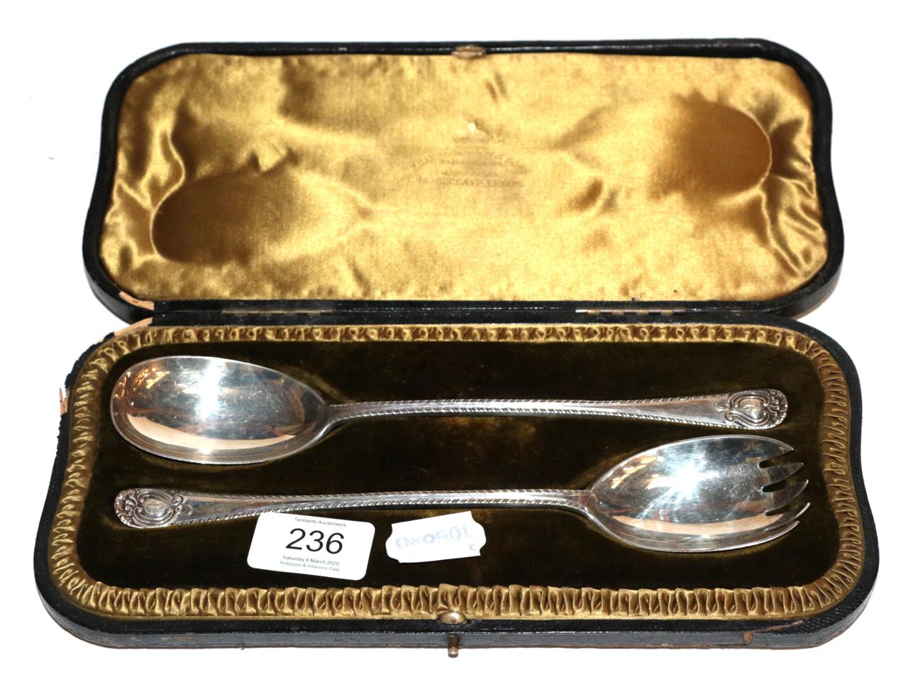 Lot 236 - A cased pair of Edward VII silver salad-servers, by Jackson and Fullerton, London, 1903,...