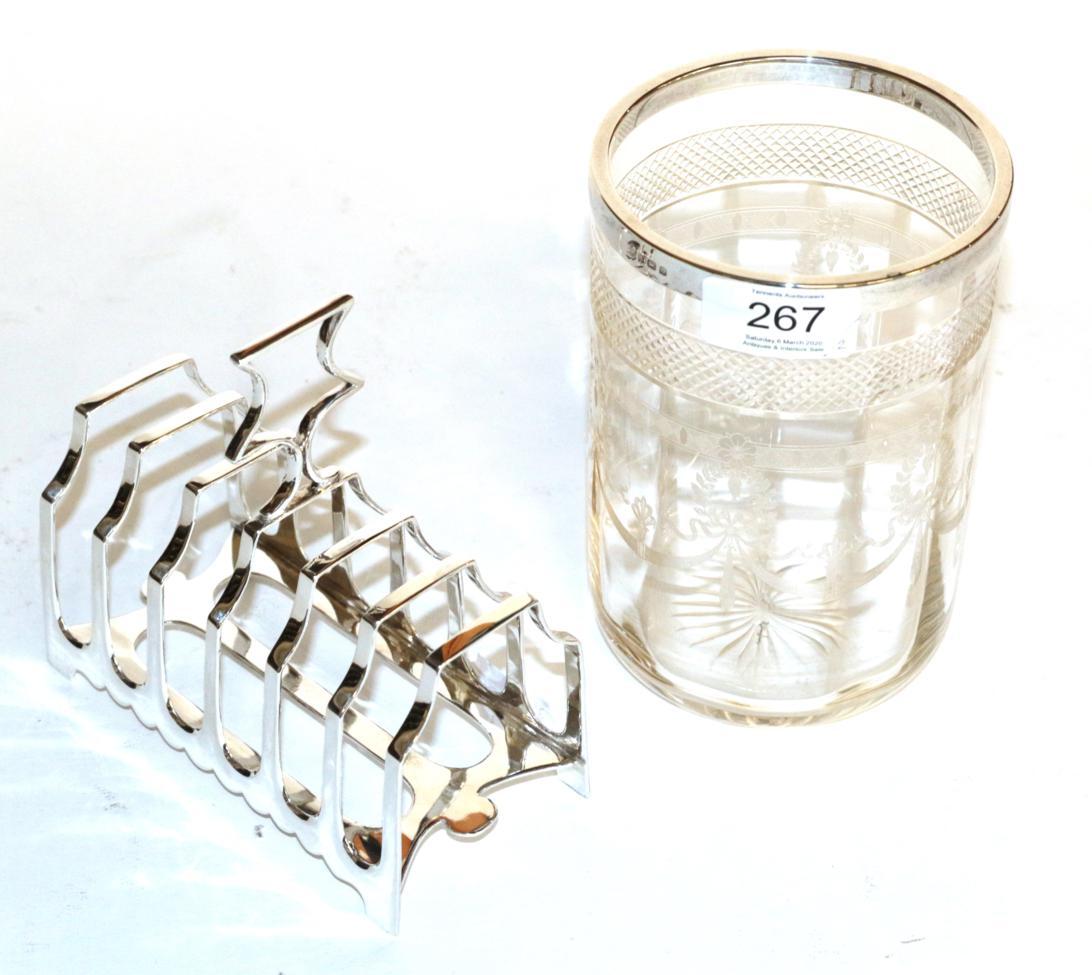 Lot 267 - A George V silver toast-rack, maker's mark probably that of James Dixon and Sons over-striking...