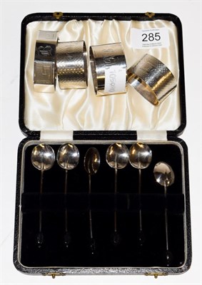 Lot 285 - A group of silver including, four various silver napkin-rings, variously engraved and a set of...