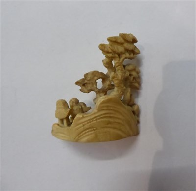 Lot 289 - A Chinese jade belt hook, carved with mythical beast head, mounted on hardwood plinth;  with...