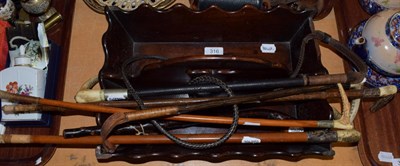 Lot 316 - A 19th century mahogany cutlery tray; and six assorted riding crops