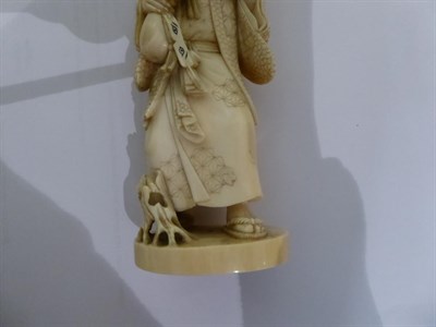 Lot 321 - A late 19th/early 20th century Japanese carved ivory figural Okimono, Meiji period, signed,...