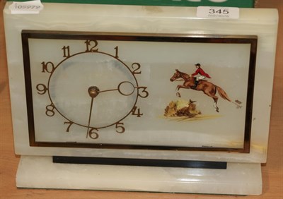 Lot 345 - An Art Deco alabaster mantel timepiece with show jumping subject
