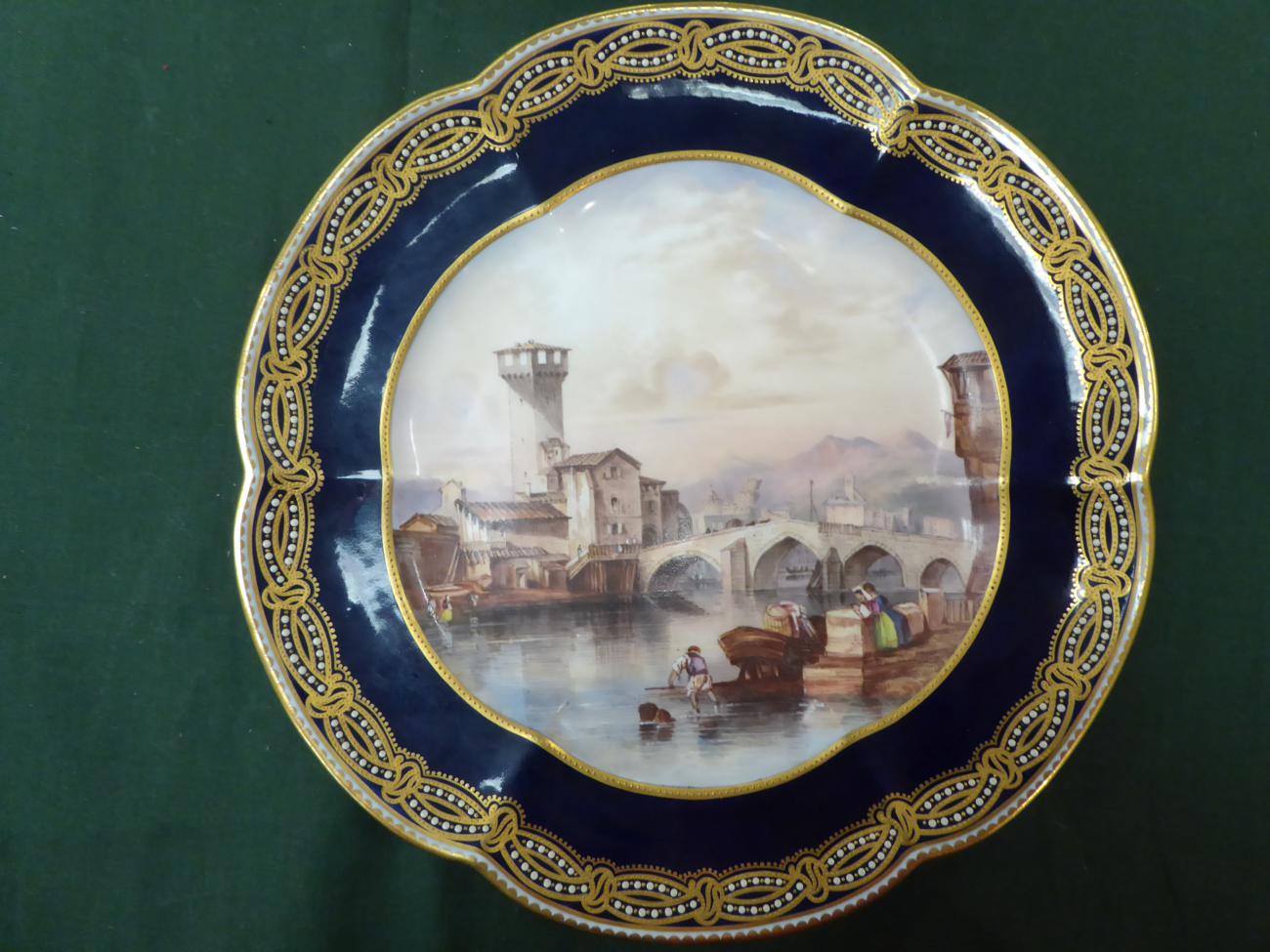 Lot 366 - A Copeland porcelain plate decorated with a Venetian scene; together with another (2)