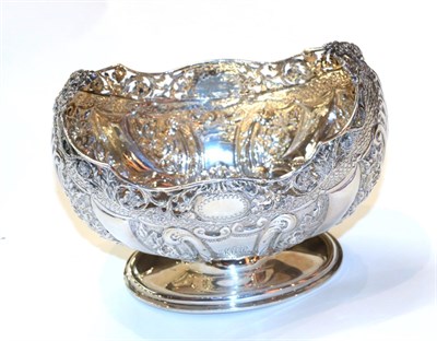 Lot 370 - A Victorian silver dish, by Jackson and Fullerton, London, 1900, oval and on spreading foot, chased