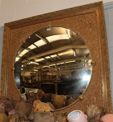 Lot 1199 - A Gilt Overmantel Mirror, the circular plate within a ropetwist border divided by lion masks,...