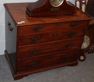 Lot 1203 - A George III mahogany bachelors chest with moulded top, four graduated drawers and carrying handles