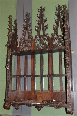 Lot 1206 - A set of Victorian Gothic revival carved oak hanging shelves, 64cm wide