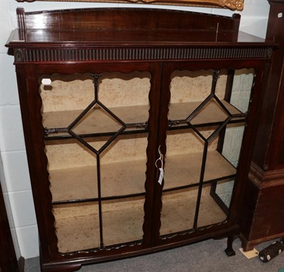Lot 1213 - An early 20th century mahogany display cabinet on claw and ball feet, 107cm wide