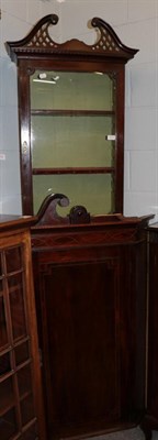 Lot 1214 - A George III mahogany corner cupboard with swan neck pediment (a.f.); and a glazed cabinet with...