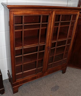 Lot 1215 - An early 20th century mahogany display cabinet with adjustable shelves, 113cm wide