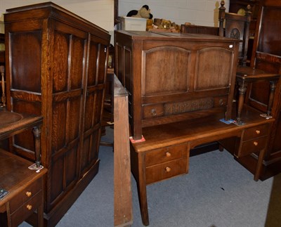 Lot 1220 - An early 20th century oak gentleman's two door wardrobe; an early 20th century desk, fitted...