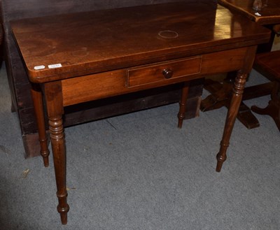 Lot 1232 - A mid 19th century mahogany fold over tea table, fitted a small drawer, 95cm wide