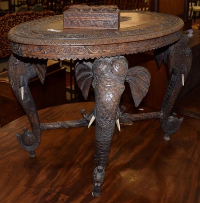 Lot 1234 - An early 20th century carved hardwood elephant table; and a small carved trinket box (2)