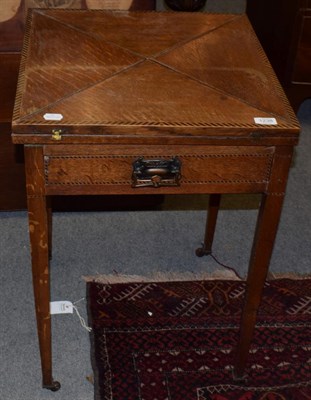Lot 1238 - An Edwardian oak and parquetry envelope card table, 49cm wide