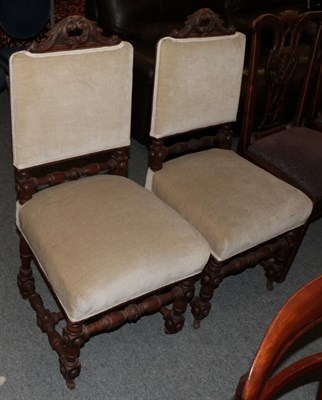 Lot 1252 - A pair of Victorian carved oak chairs with upholstered seats