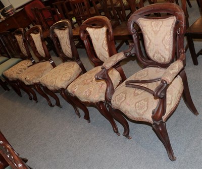 Lot 1262 - A set of five Victorian carved mahogany dining chairs, including one carver