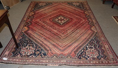 Lot 1267 - Kashgai carpet, the faded rose pink field of boteh and geometric devices around a stepped medallion