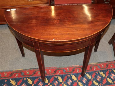 Lot 1268 - A George III mahogany fold over tea table