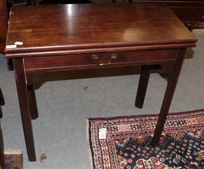 Lot 1271 - A George III mahogany fold over tea table, on square chamfered legs, 79cm wide